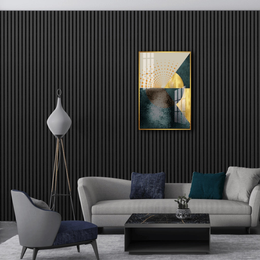Modern living room with a gray sofa, armchair, and abstract art on a black oak acoustic panelled wall.