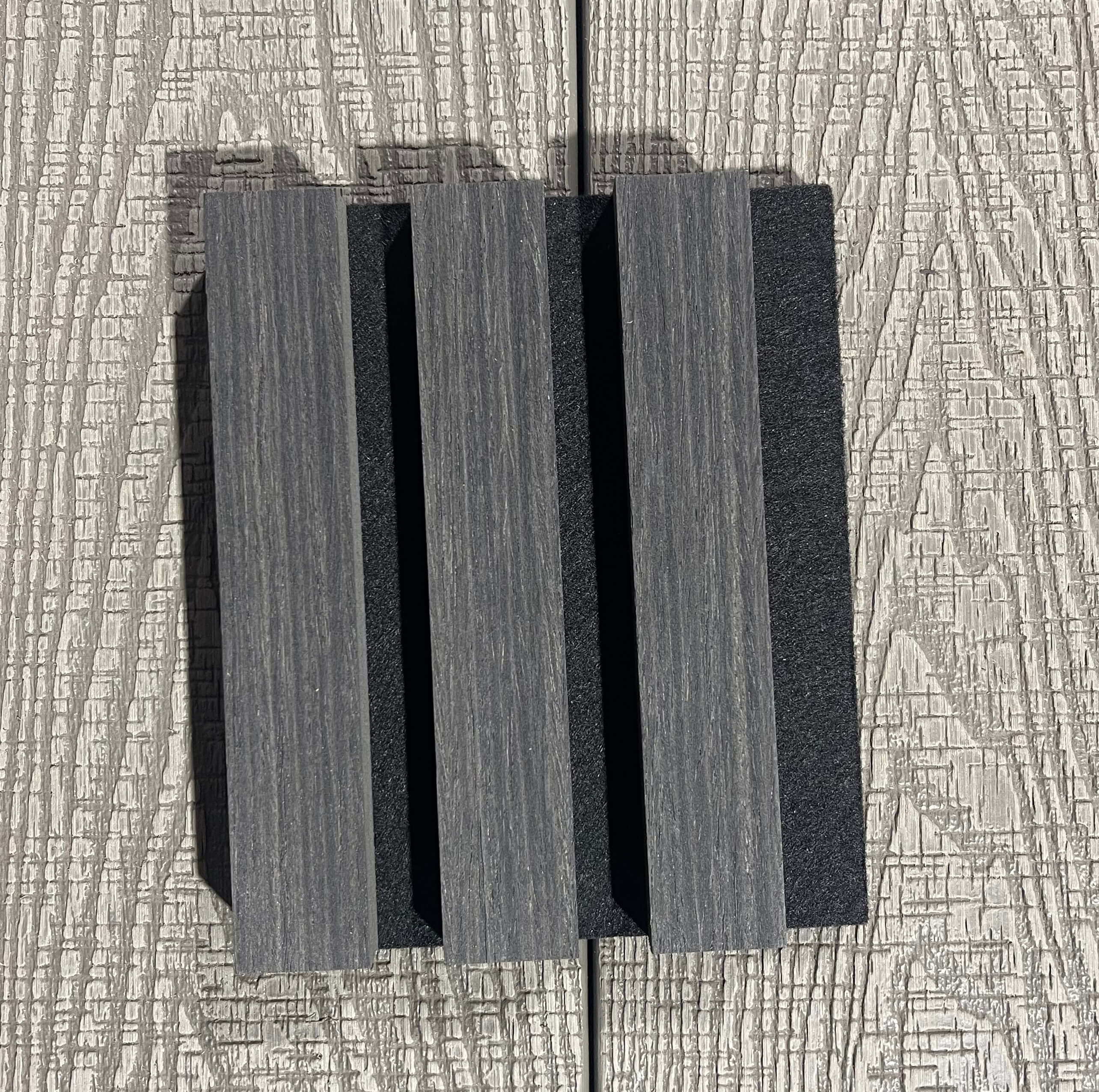 Decorative wall panel with a textured finish on a textured wall.