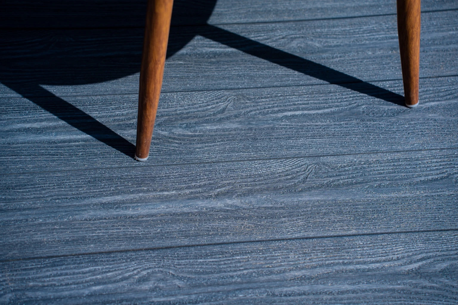 charcoal dual-capped premium composite decking boards in situ