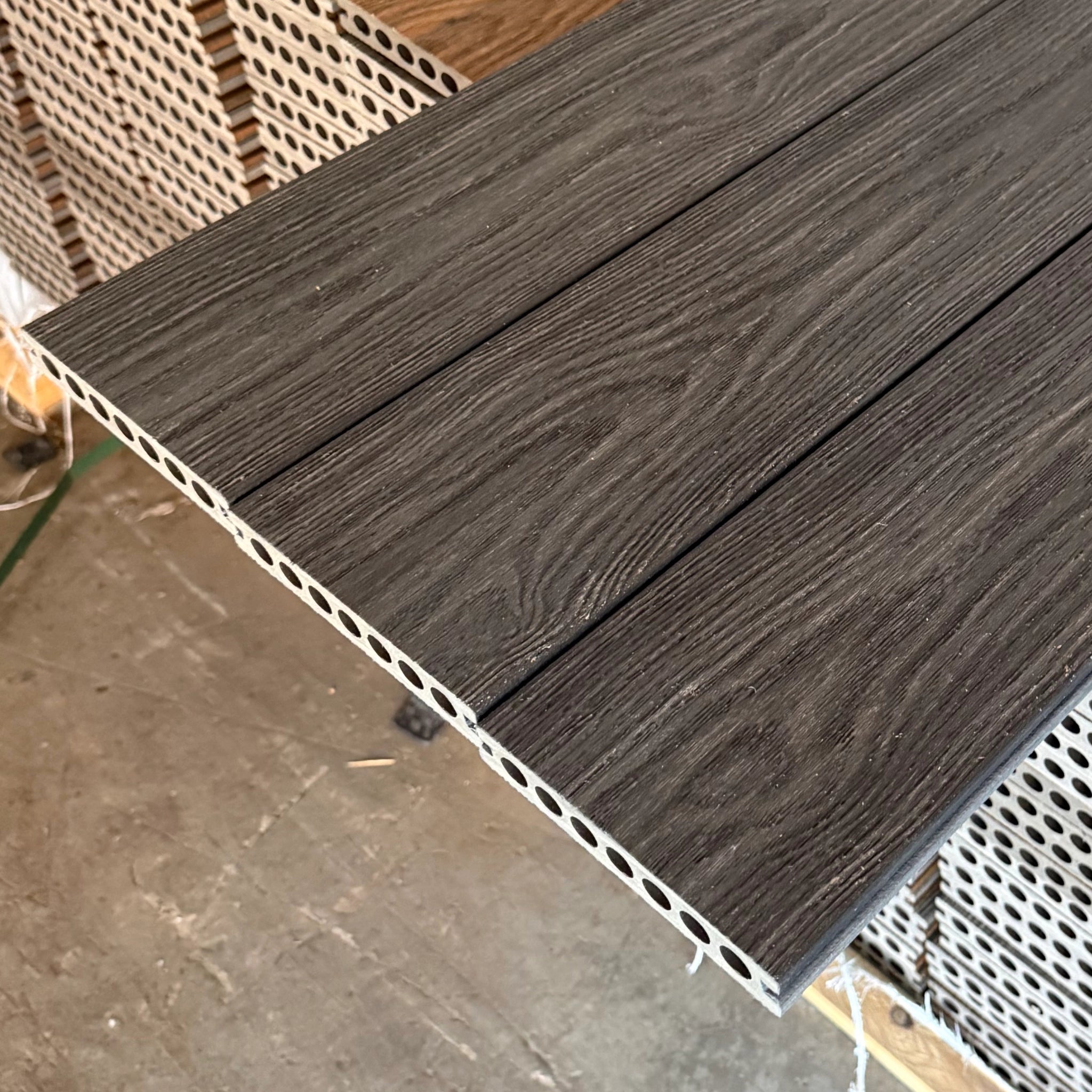 Charcoal  Premium Dual-Capped Composite Decking Board close up row of 3 boards