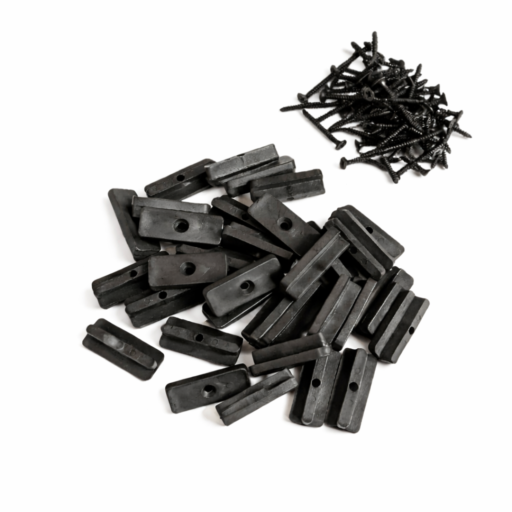 Collection of black plastic brackets and screws on a white background