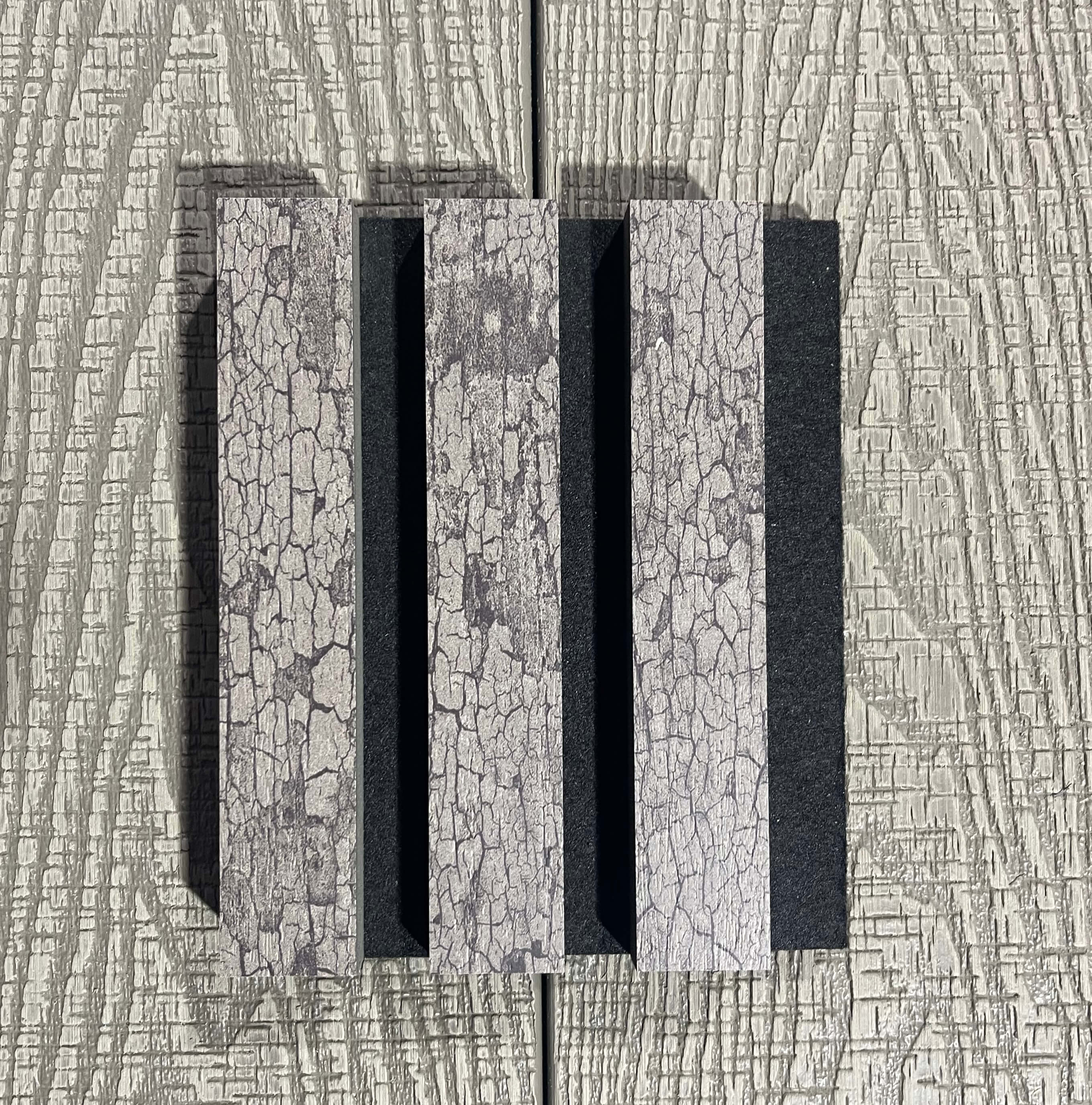 Close-up of a textured wall with a rectangular recessed area