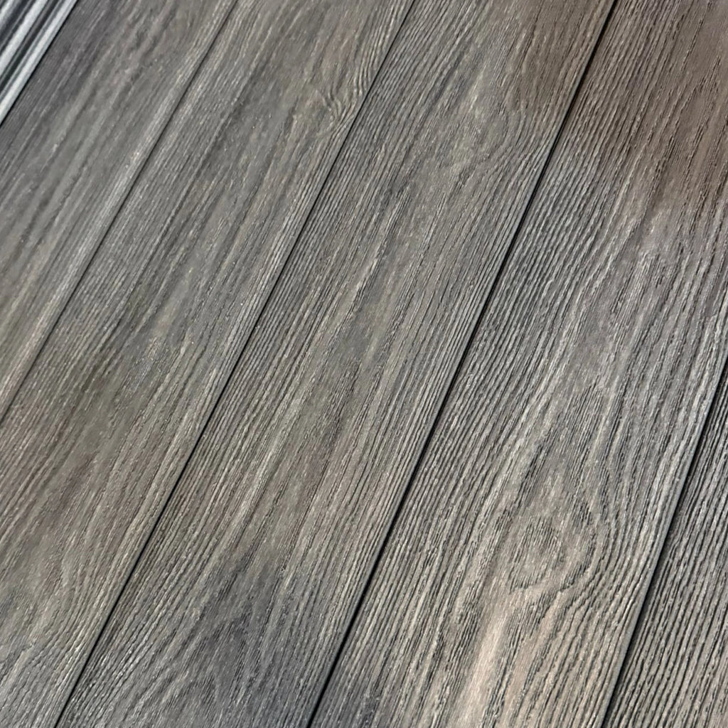 premium dual-capped charcoal composite decking boards close up 