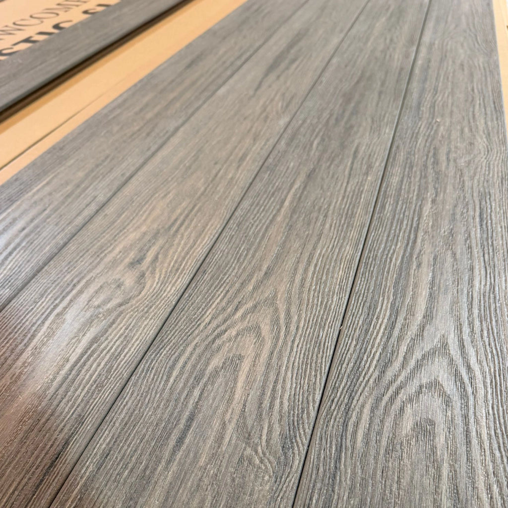 premium dual capped jade composite decking boards  row on pallet