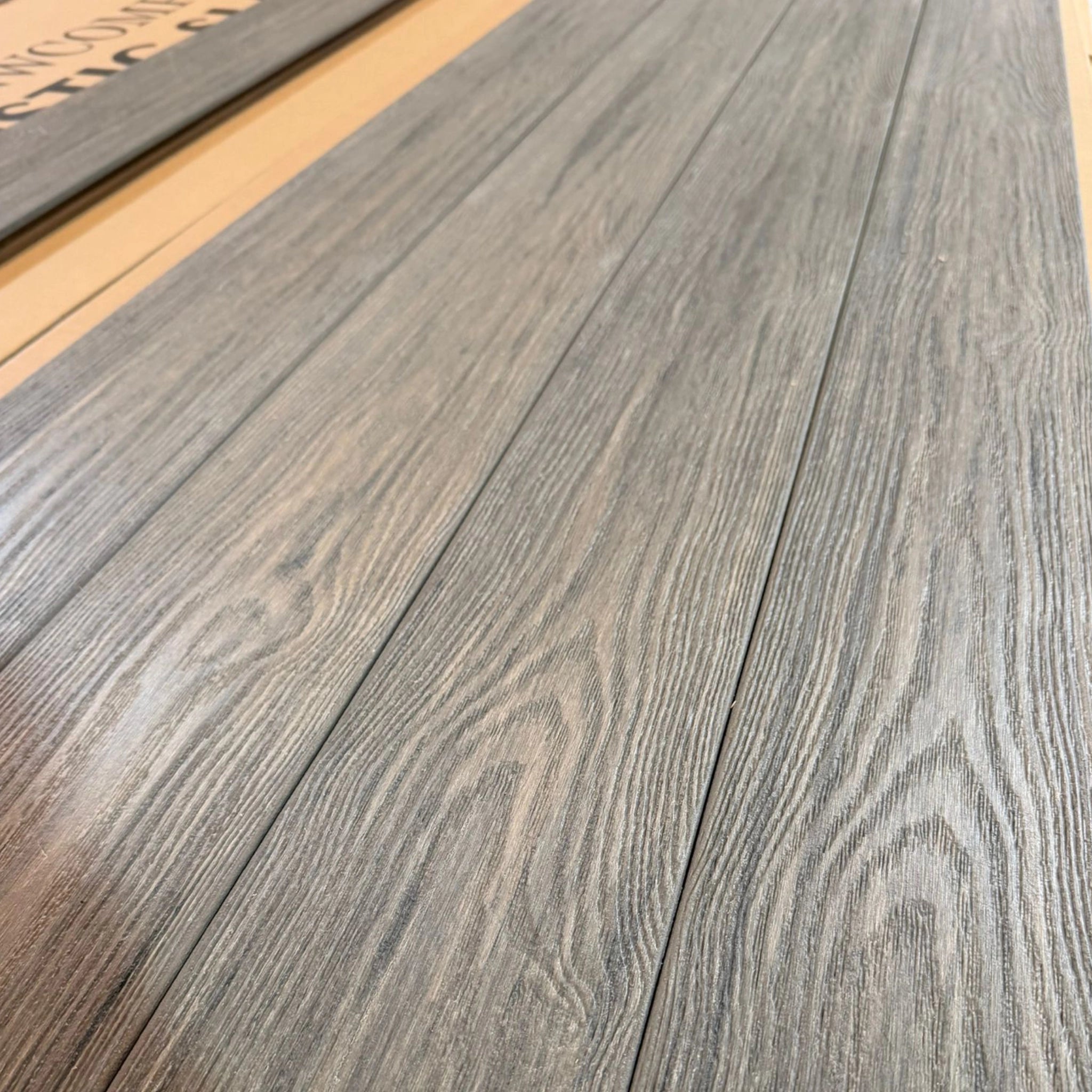 premium dual capped jade composite decking boards  row on pallet