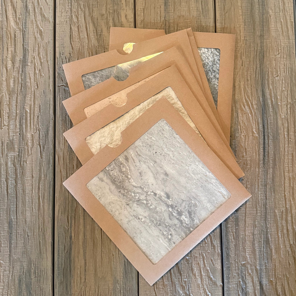 a selection of flexistone samples on a composite decking row of boards