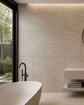 Modern bathroom with a freestanding bathtub against a flexistone wall