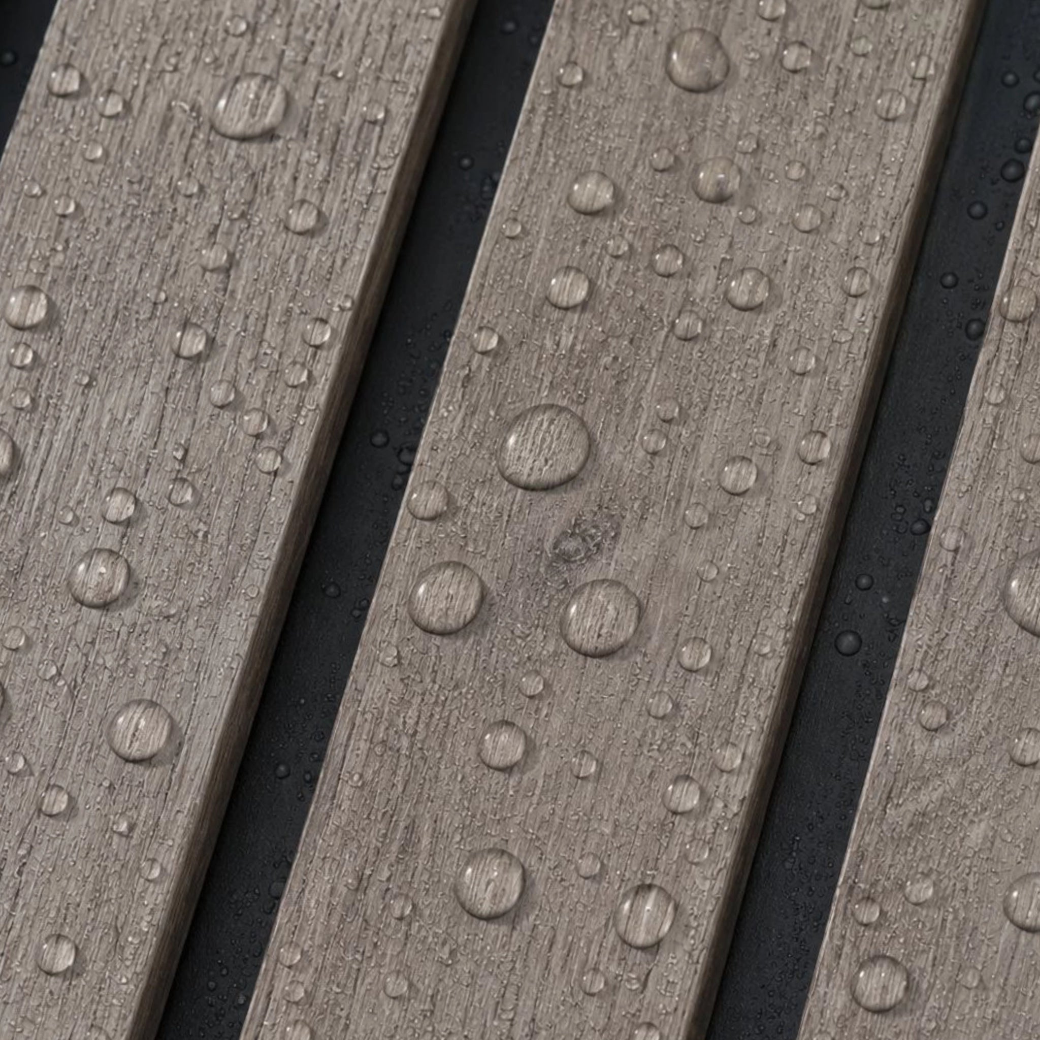 close up of grey aqua slat wall panels with water droplets on them