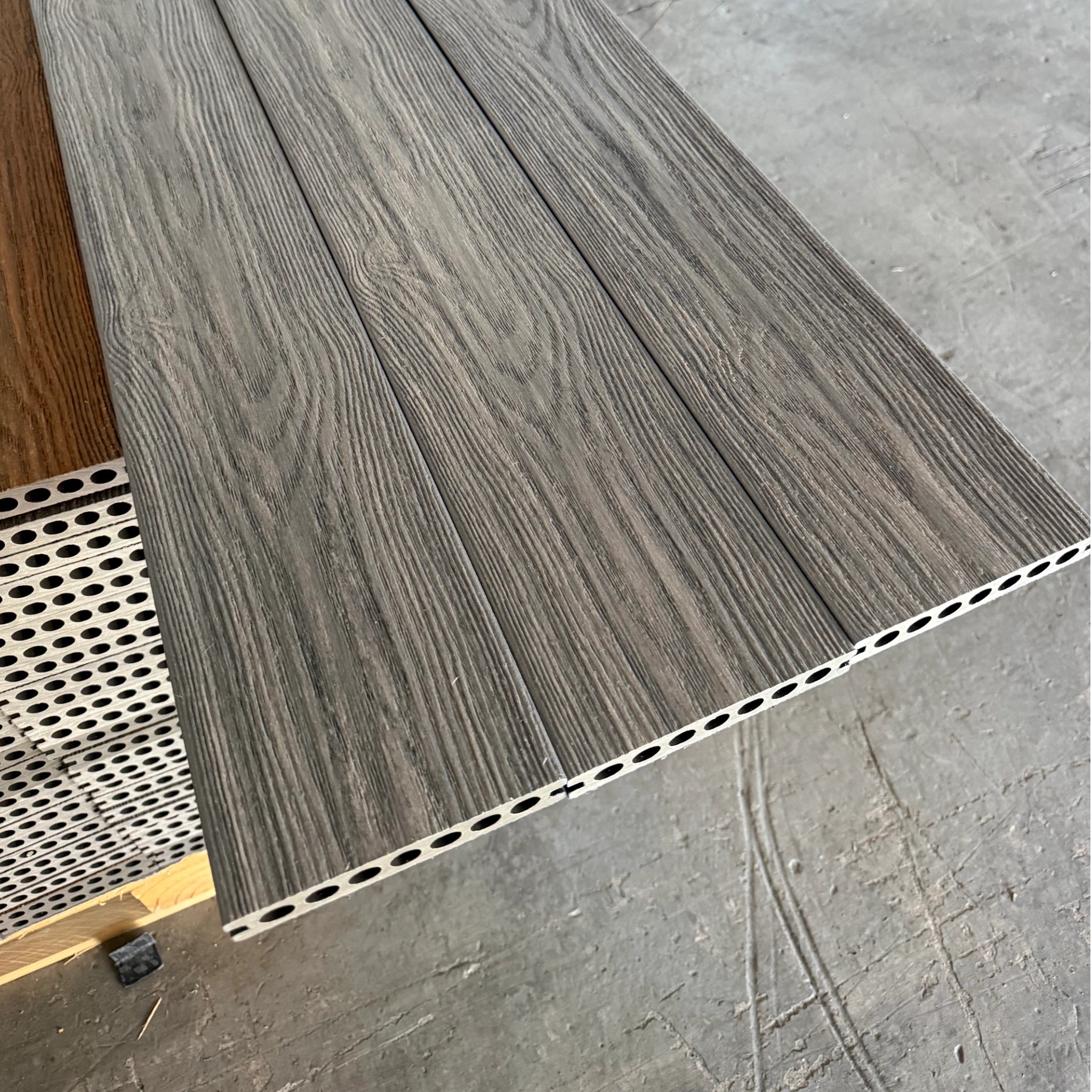 grey Premium Dual-Capped Composite Decking Board close up row of 3 boards