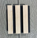 Wooden slats with black separators on a textured gray background