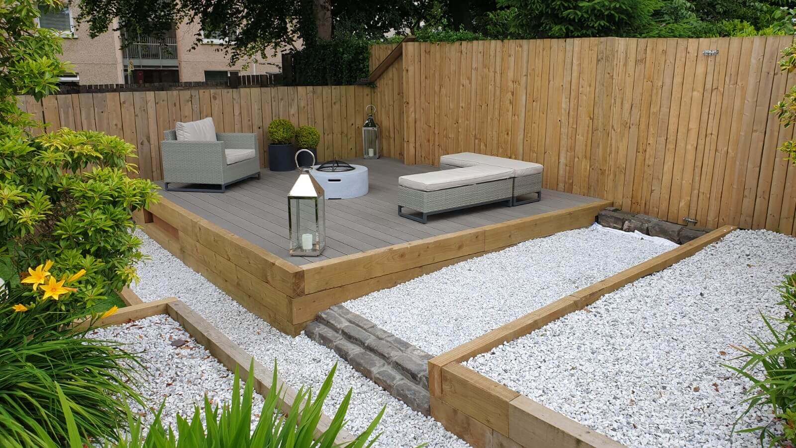 Backyard with a salt lake silver deck, outdoor furniture, and landscaping.