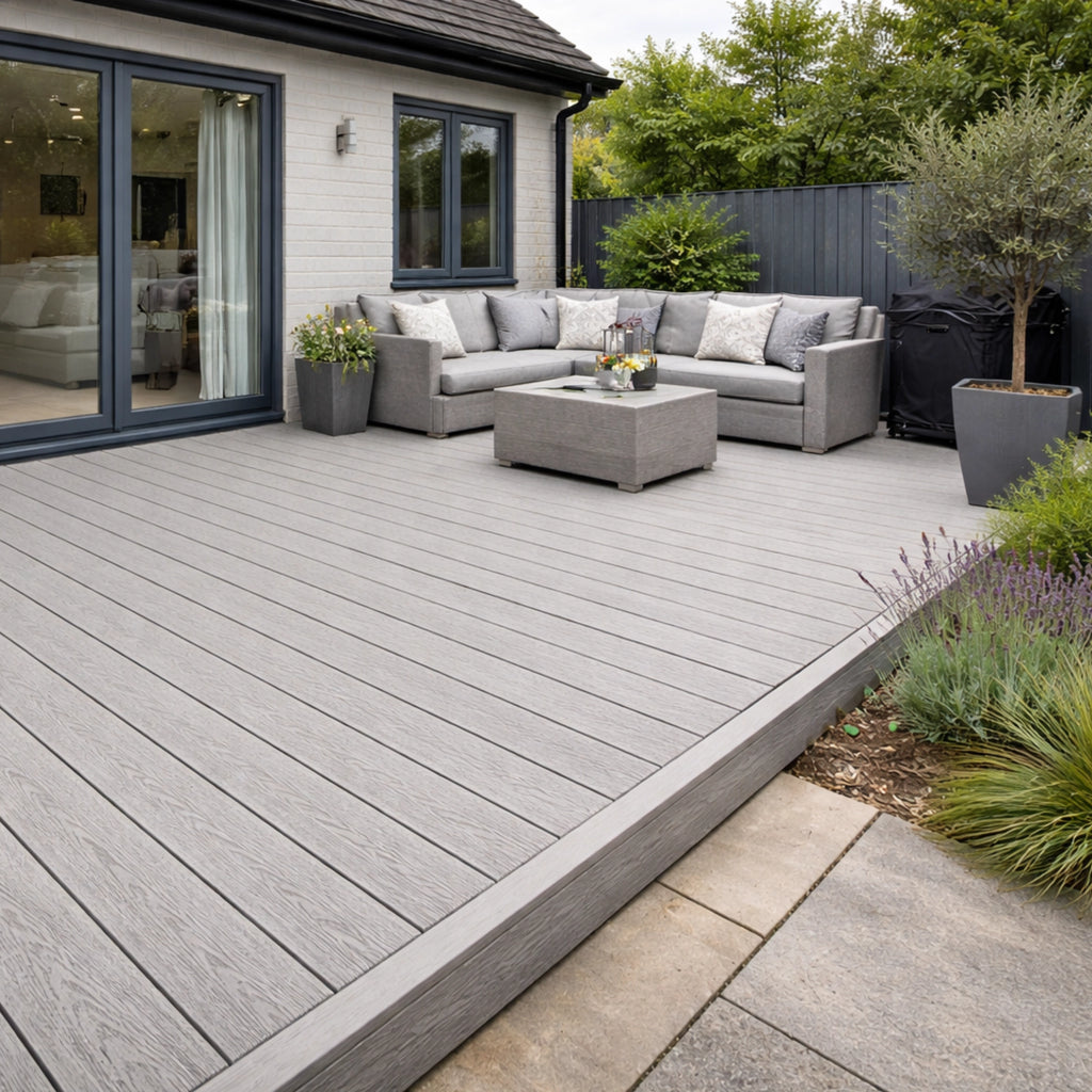 Outdoor patio with salt lake silver deck, sectional sofa, and potted plants.