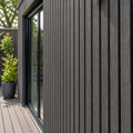 slate co extrusion cladding lifestyle image on a garden room building