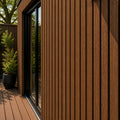 teak co extrusion cladding lifestyle image on a garden room building
