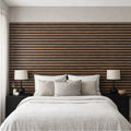 Modern bedroom with walnut wooden slat wall and white bedding