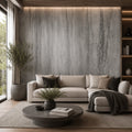 Modern living room with a gray sofa, round coffee table, and decorative elements.
