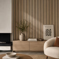 Modern living room with nw composite oak acoustic wall panel on the wall, wooden cabinet, and decorative items.
