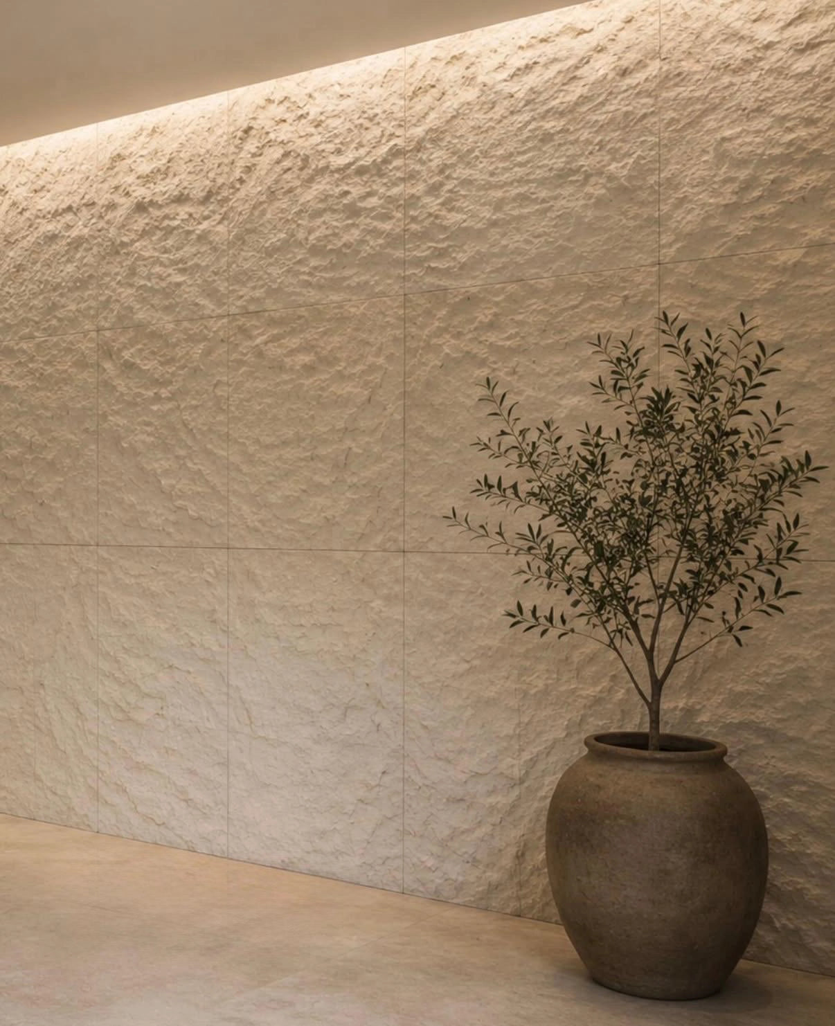 flexistone off white rough granite wall with a decorative vase in a modern interior setting.