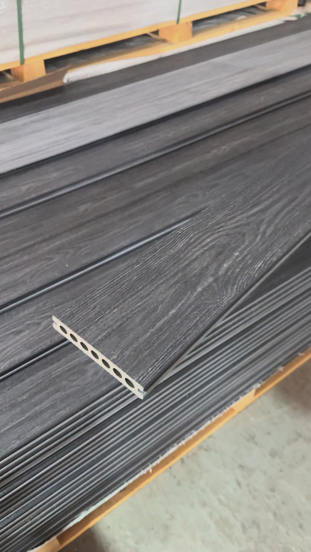 Charcoal / grey premium dual capped composite decking video showing both sides flipped