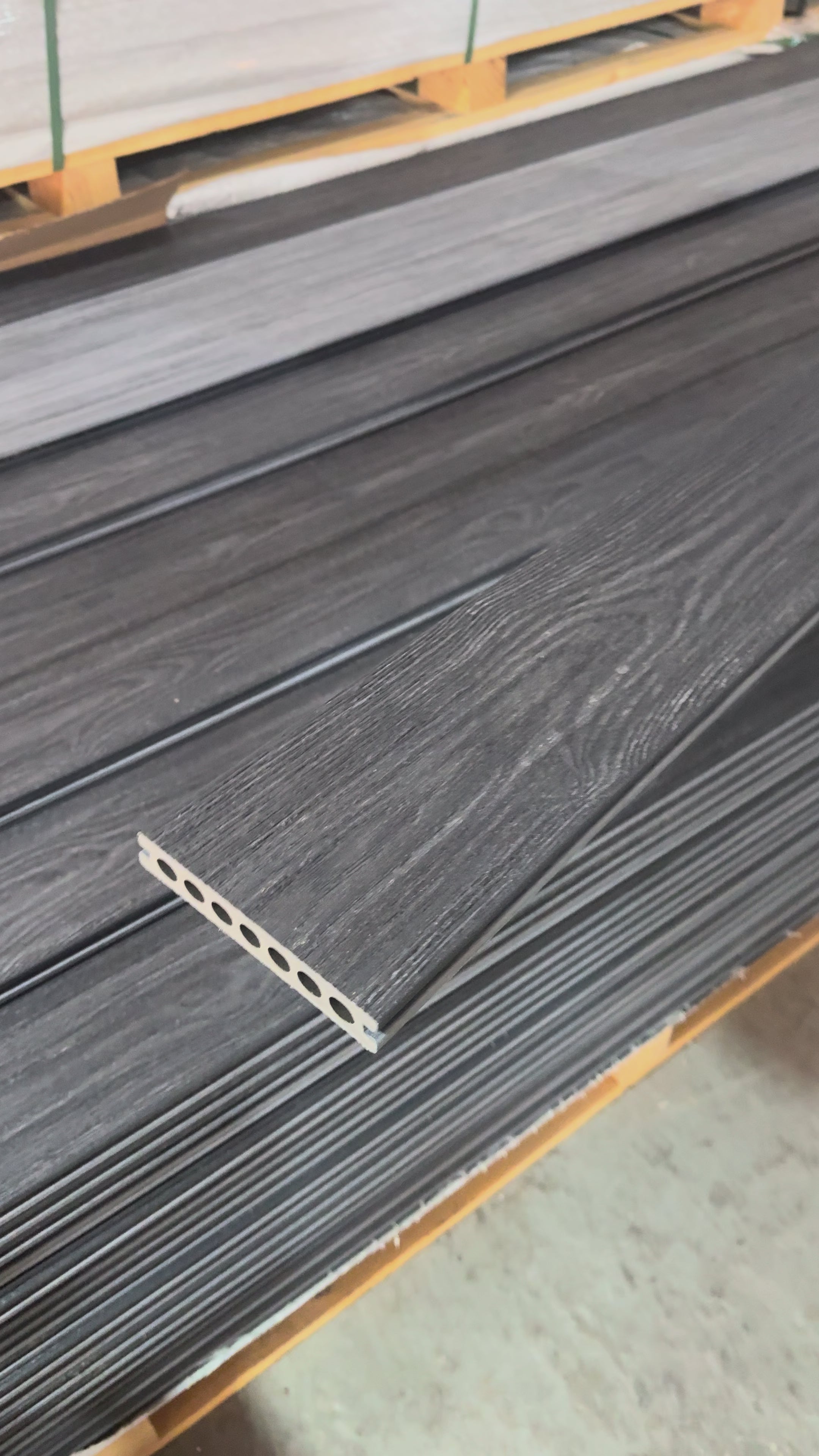 Charcoal / grey premium dual capped composite decking video showing both sides flipped